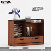 A promotional image of the "RETRO Mini Bookshelf" in a dark wood finish. The compact, modern storage unit has a dark, reddish-brown wood grain with contrasting black trim. It features two drawers at the bottom and an asymmetrical arrangement of open shelving above, which are filled with books. The multi-level top surface is styled with a small white vase of flowers and a decorative sign. The "BONGO" and "RETRO" brand names are displayed in the top corners.